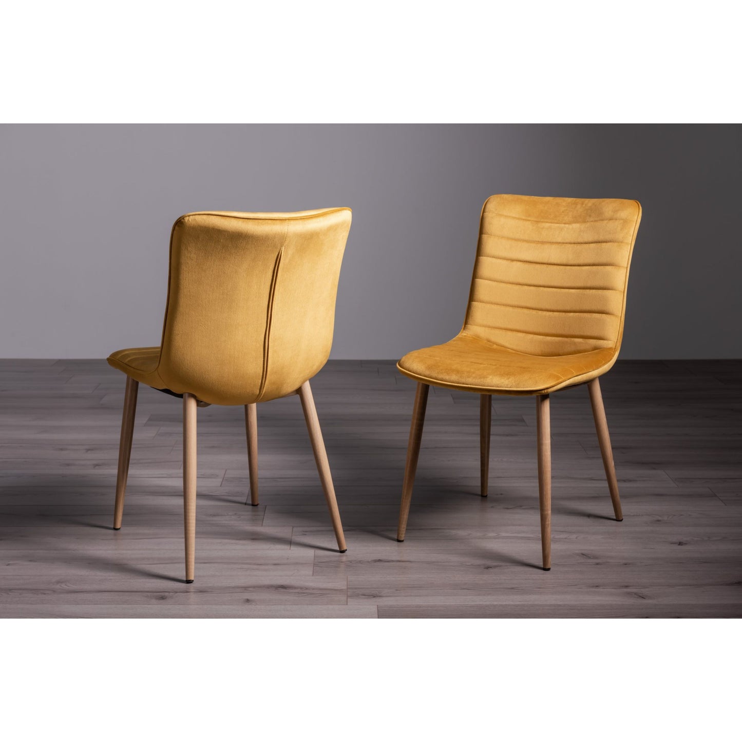 Pair of Velvet Dining Chairs with Horizontal Stitching and Oak Effect Wooden Legs in a Choice of Three Colours