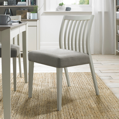 Pair of Grey Washed Low Slat Back Dining Chairs with with 100% Polyester Titanium Coloured Fabric Seat