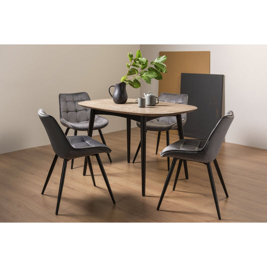 4 Seater 129cm Weathered Oak Table Set with 4 Grey Shaped Velvet Dining Chairs Featuring Black Legs and Square Stitched Upholstery