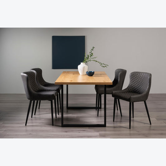 6 Seater 160cm Dining Table Featuring Rustic Oak Effect Top with U-Shaped Legs and 4 Dark Grey Faux Leather Armchairs