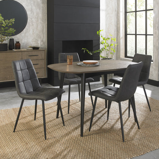 4 Seater 129cm Weathered Oak Table Set with 4 Dark Grey Faux Leather Dining Chairs Featuring Black Legs and Square Stitched Upholstery