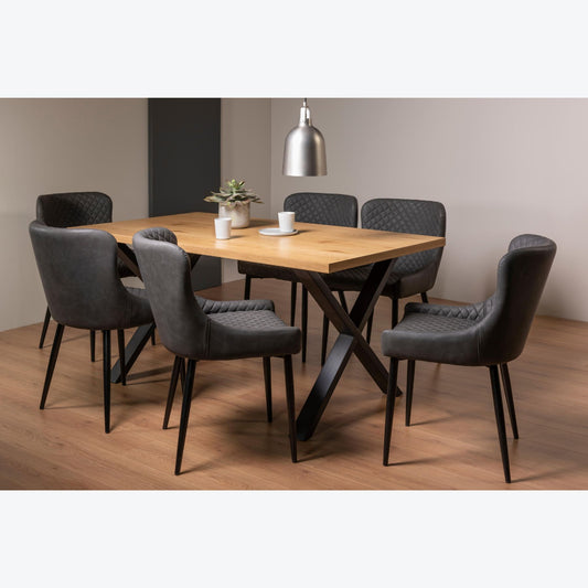 6 Seater 160cm Rectangle Oak Effect Dining Table Set with 6 Dark Grey Faux Leather Armchairs Featuring Diamond Quilted Stitching.