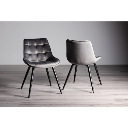 Pair of Velvet Dining Chairs with Square Stitched Upholstery, Shaped Seating, and Sand Black Metal Legs, Available in a Choice of Three Colors.