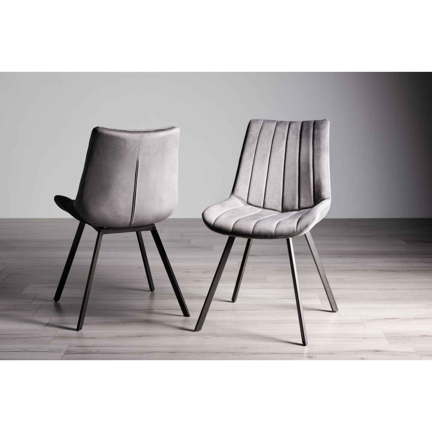 Pair of Velvet Dining Chairs with Vertical Stitching and Sand Black Metal Frame in a Choice of Three Colours