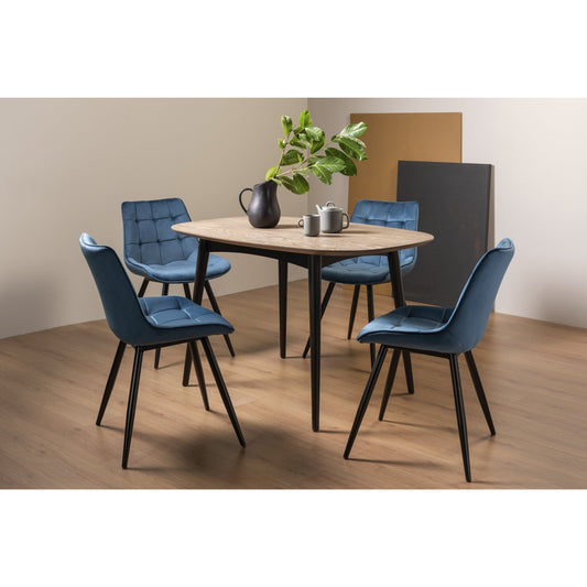 4 Seater 129cm Weathered Oak Table Set with 4 Shaped Blue Velvet Dining Chairs Featuring Black Legs and Square Stitched Upholstery