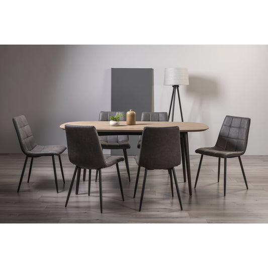 6 Seater 175cm Weathered Oak Table Set with 6 Dark Grey Faux Leather Dining Chairs Featuring Black Legs and Square Stitched Upholstery