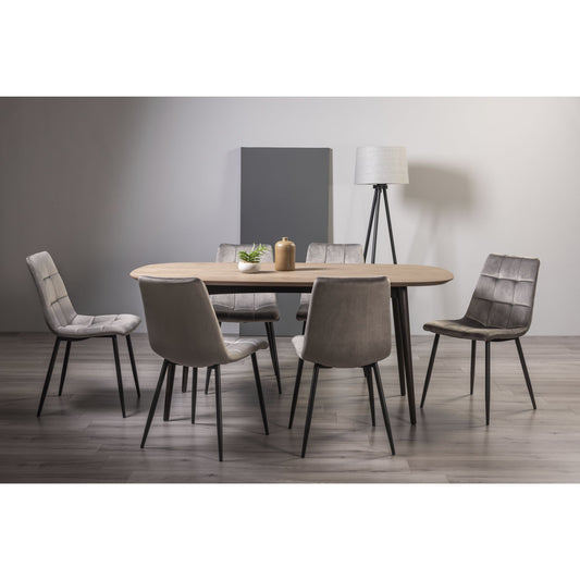 6 Seater 175cm Weathered Oak Table Set with 6 Dark Grey Velvet Dining Chairs Featuring Black Legs and Square Stitched Upholstery