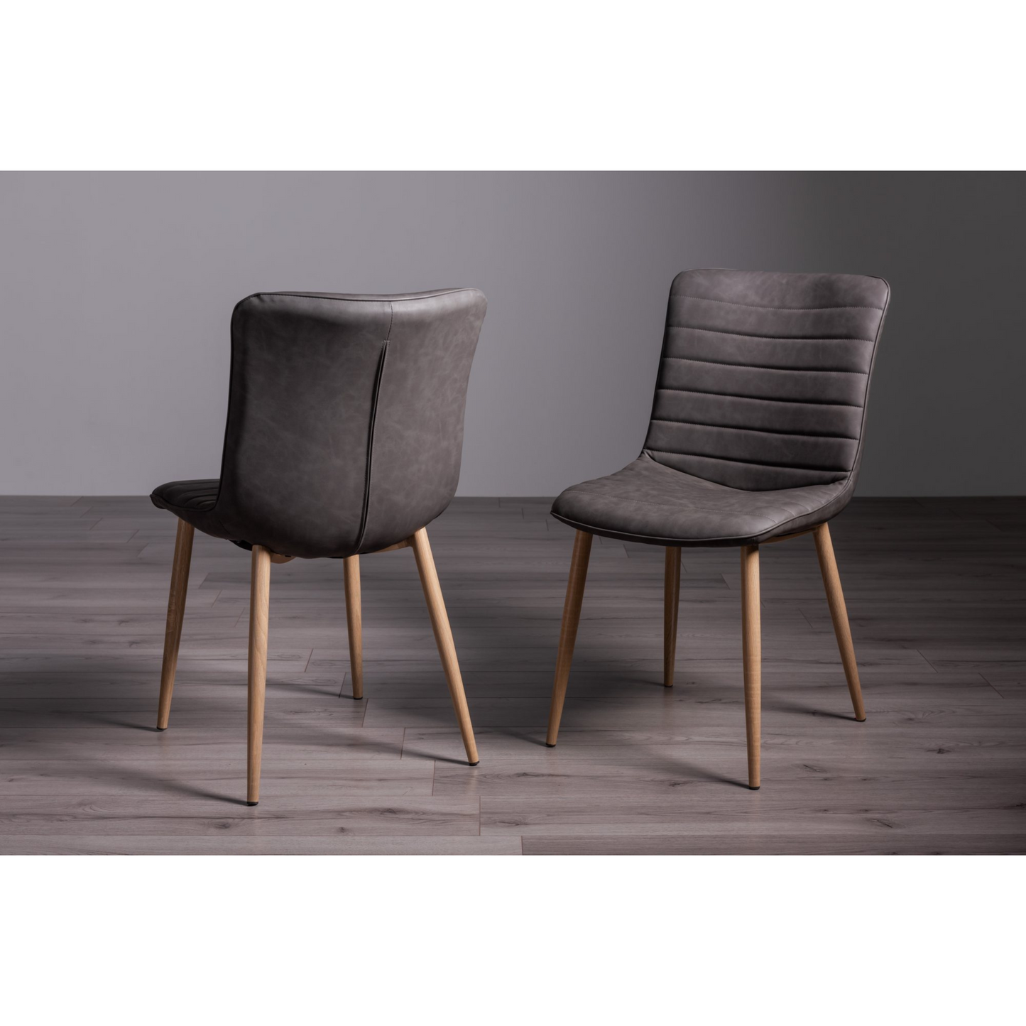 Pair of Faux Leather Dining Chairs in Dark Grey with Horizontal Stitching and Oak Effect Wooden Legs